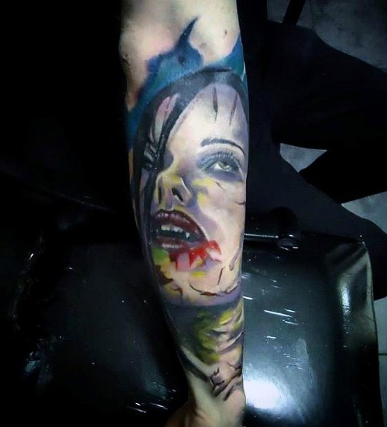 Simple designed colored bloody vampire woman tattoo on arm