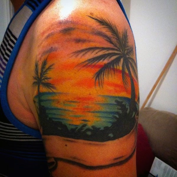 Simple designed romantic island shore shoulder tattoo with sunset