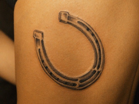 Simple elegant horseshoe tattoo