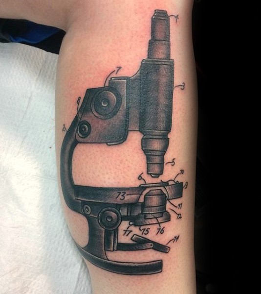Simple engraving style leg tattoo of vintage microscope