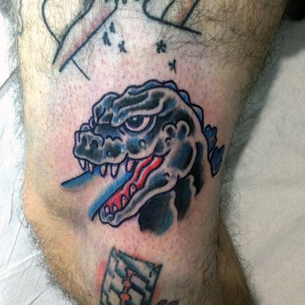 Tatuaje en la pierna,
Godzilla divertida con luz azul