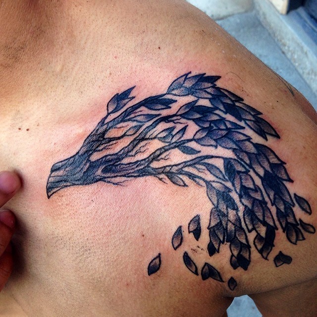 Simple homemade black ink shoulder tattoo of tree branch