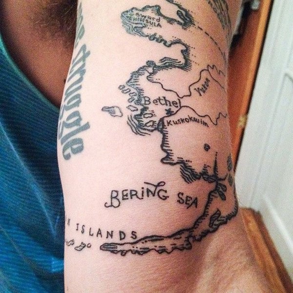 Simple homemade like black ink arm tattoo of world map part