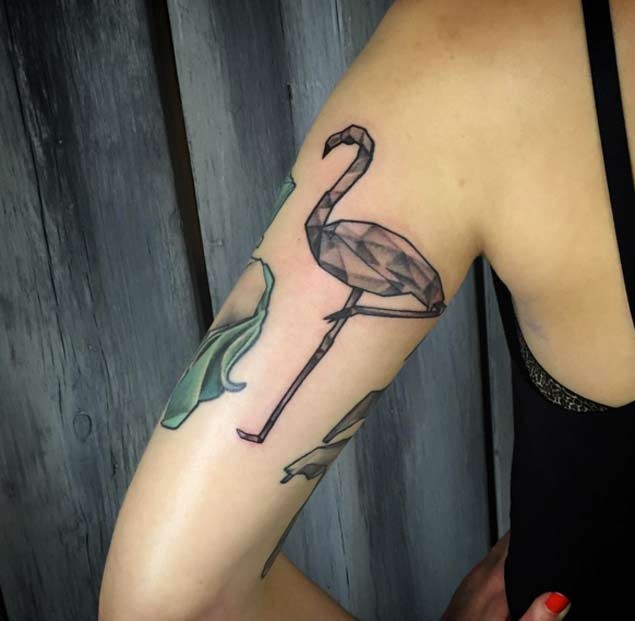 Simple homemade like black ink flamingo tattoo on arm