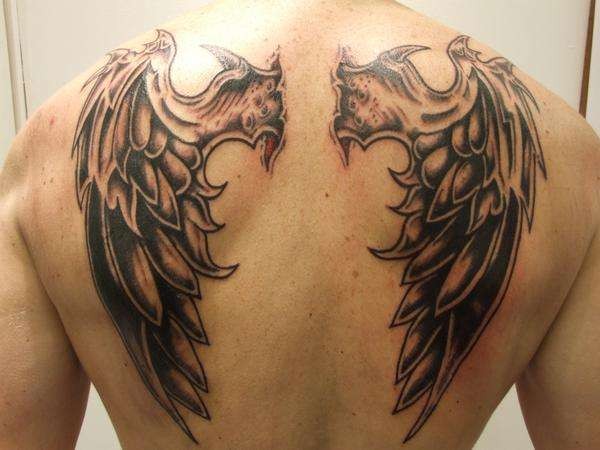 Tatuaje en la espalda, dos demonios semejantes con alas - Tattooimages.biz