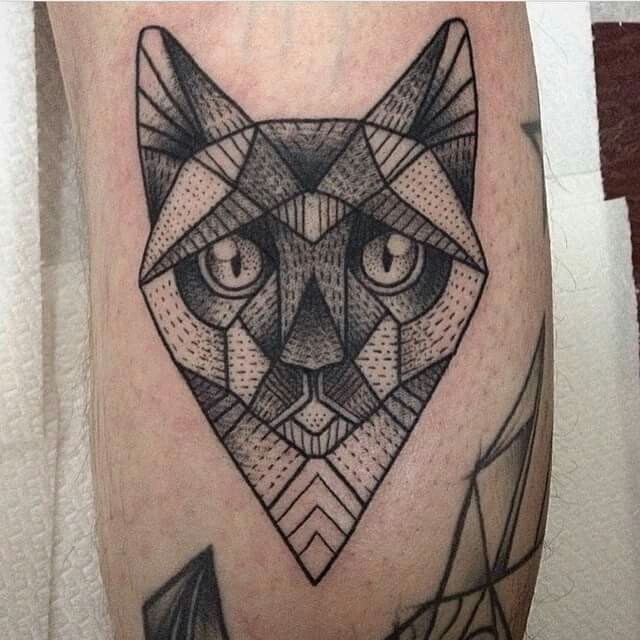 Simple looking black ink leg tattoo of dot style cat