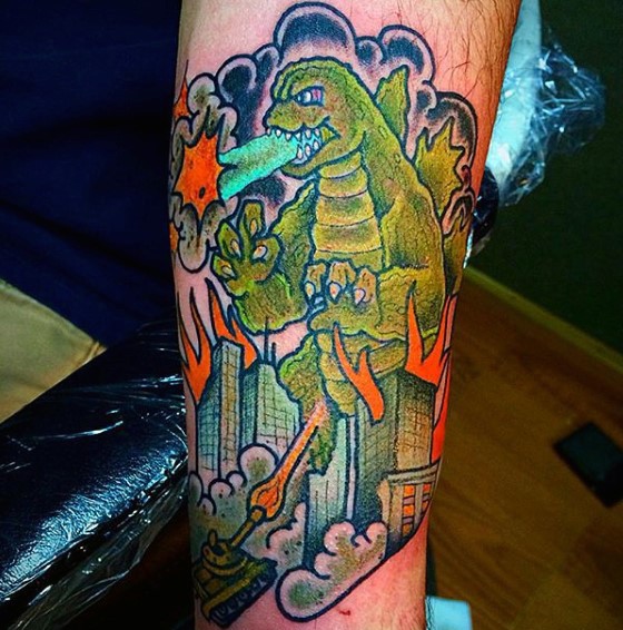 Simple multicolored old style Godzilla tattoo on leg
