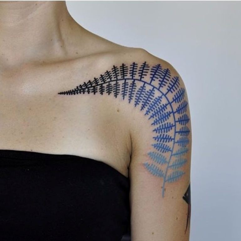 Simple multicolored shoulder tattoo of fern leaf
