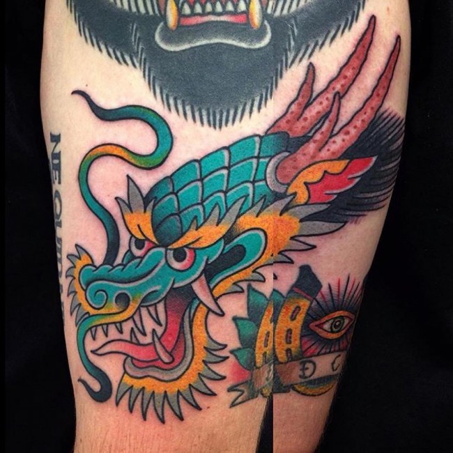 Simple old school colored arm tattoo of dragon