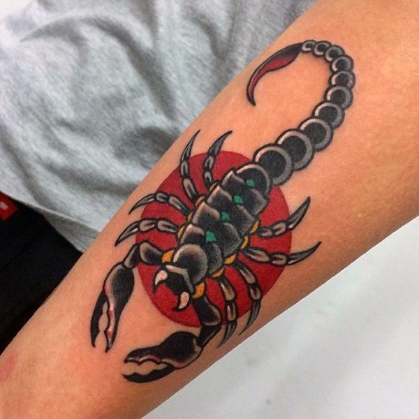 Simple painted and colored little scorpion tattoo on arm