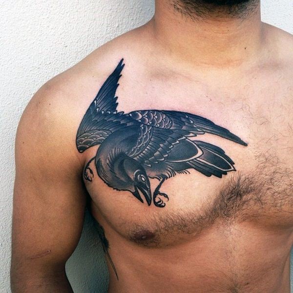 Simple painted big black and white detailed crow tattoo on chest