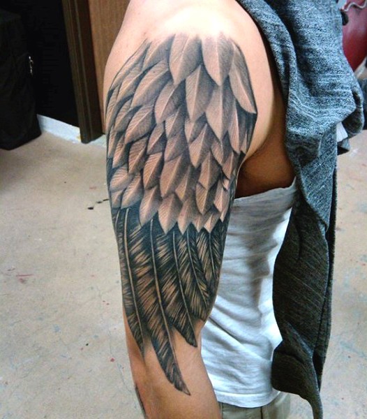 Simple painted black and white fantasy wing half sleeve tattoo