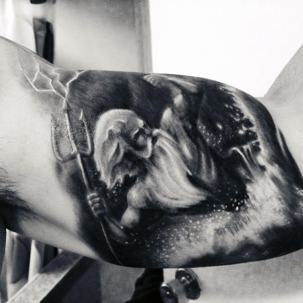 Simple painted black and white Poseidon tattoo on biceps