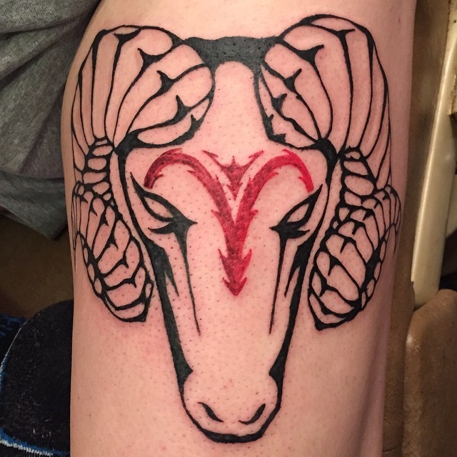 Simple painted black ink goat head tattoo combined with red colored Capricorn symbol