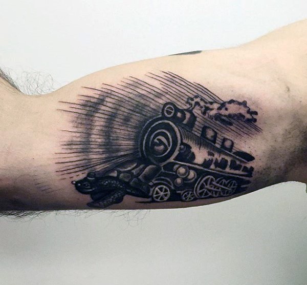 Simple painted little black ink old train tattoo on arm