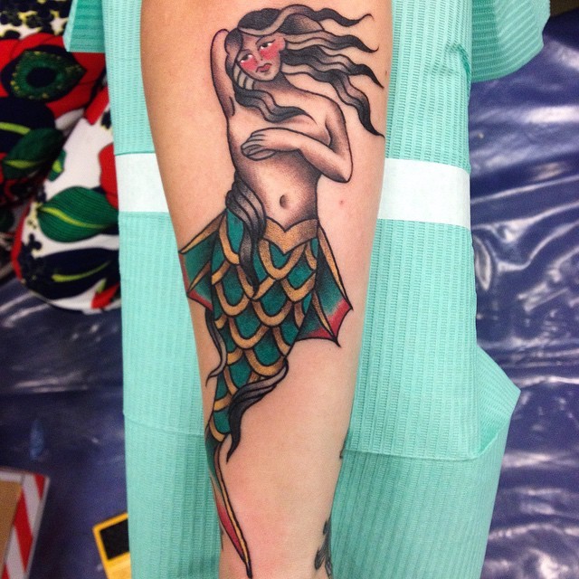 Simple painted old school style forearm tattoo of mermaid