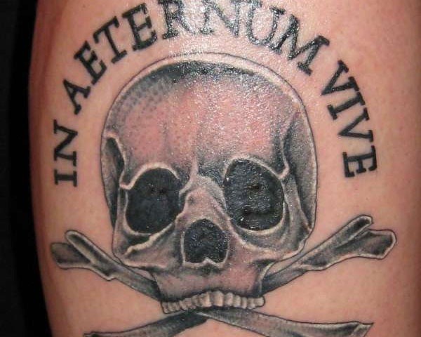 Simple pirate style black ink skull with bones tattoo combined with lettering
