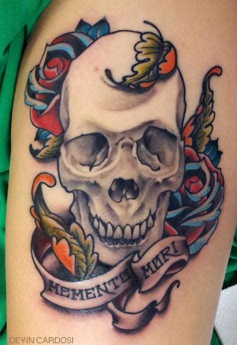Simple style painted big skull with flowers and lettering tattoo on thigh
