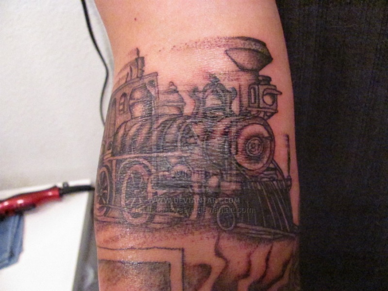 Sketch style black ink arm tattoo of steam train