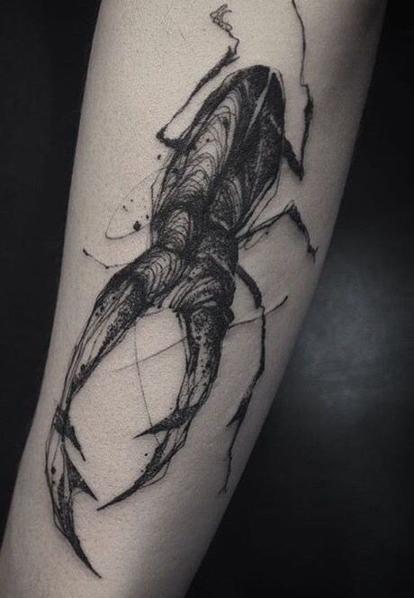 Sketch style black ink forearm tattoo of big bug