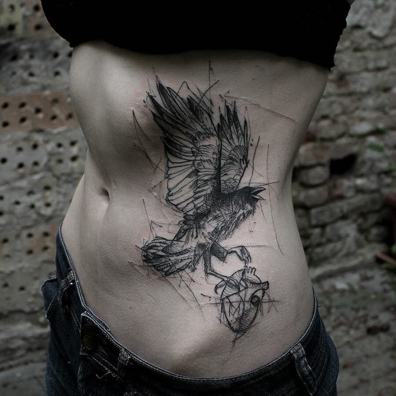 Sketch style black ink side tattoo of crow with human heart
