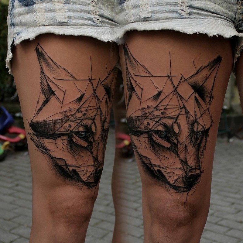 Sketch style black ink thigh tattoo of fox face