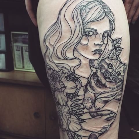 Sketch style black ink thigh tattoo of woman with cat and flowers