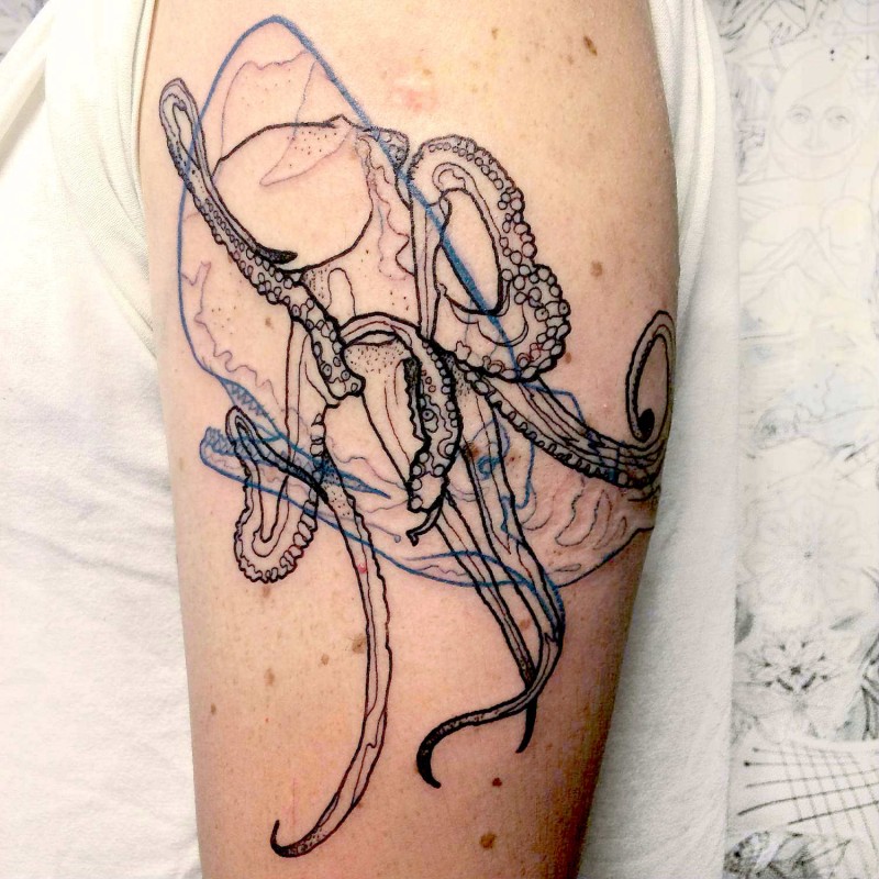 Sketch style colored arm tattoo of octopus with whale