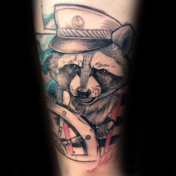Sketch style colored arm tattoo of raccoon sailor