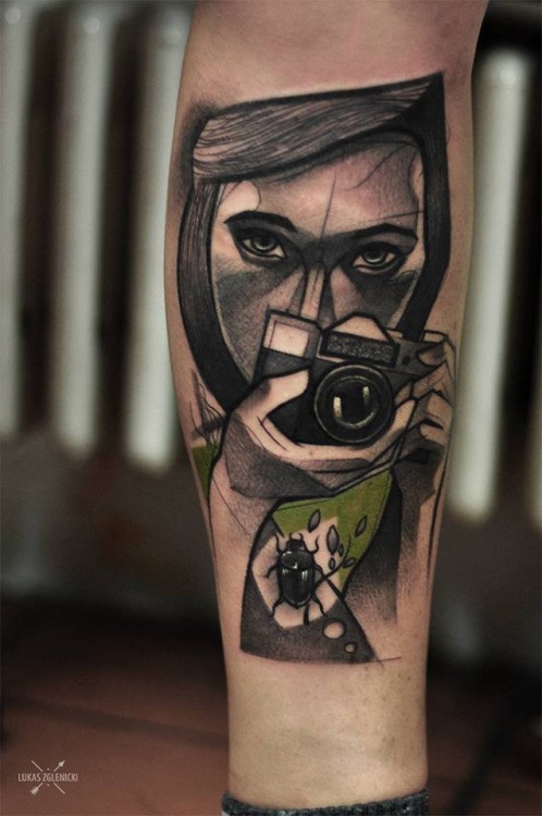 Sketch style colored arm tattoo of woman with camera and bug