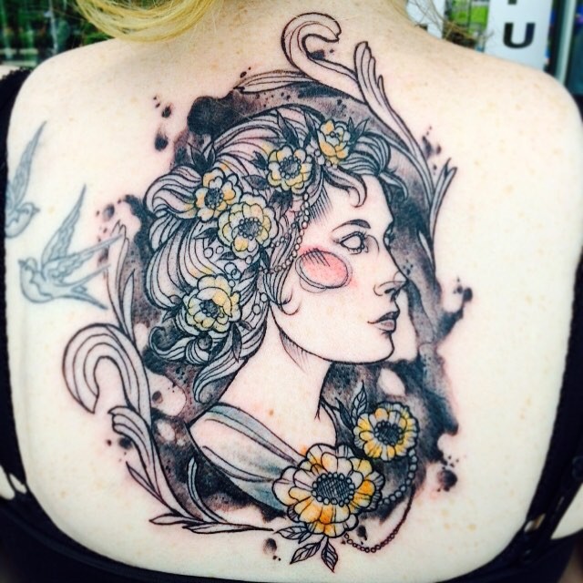Sketch style colored back tattoo of woman with flowers