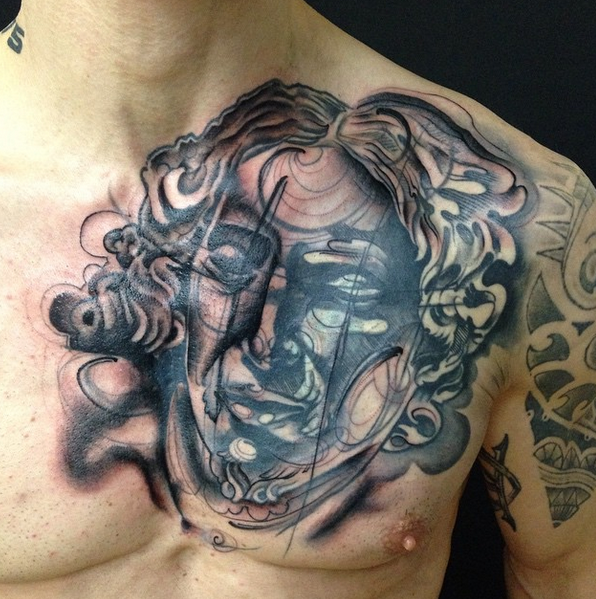 Sketch style colored chest tattoo of human face with hair