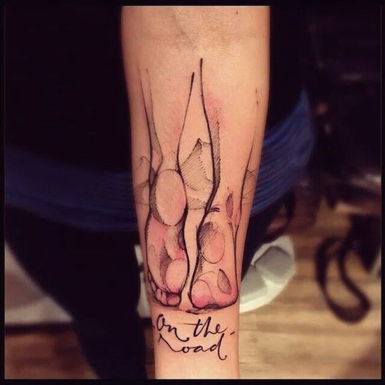 Sketch style colored forearm tattoo of man legs with lettering