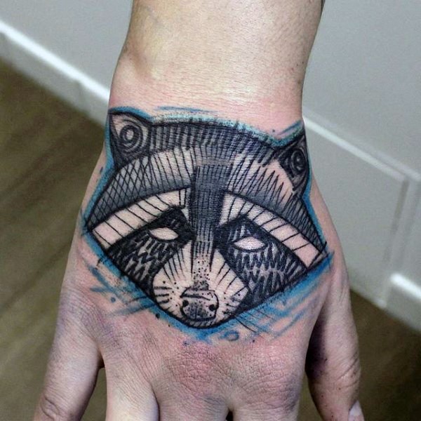 Sketch style colored hand tattoo of raccoon head