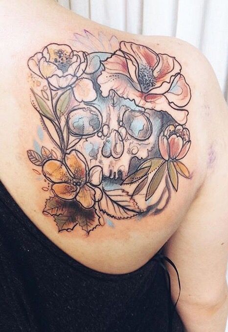 Sketch style colored scapular tattoo of human skull with flowers