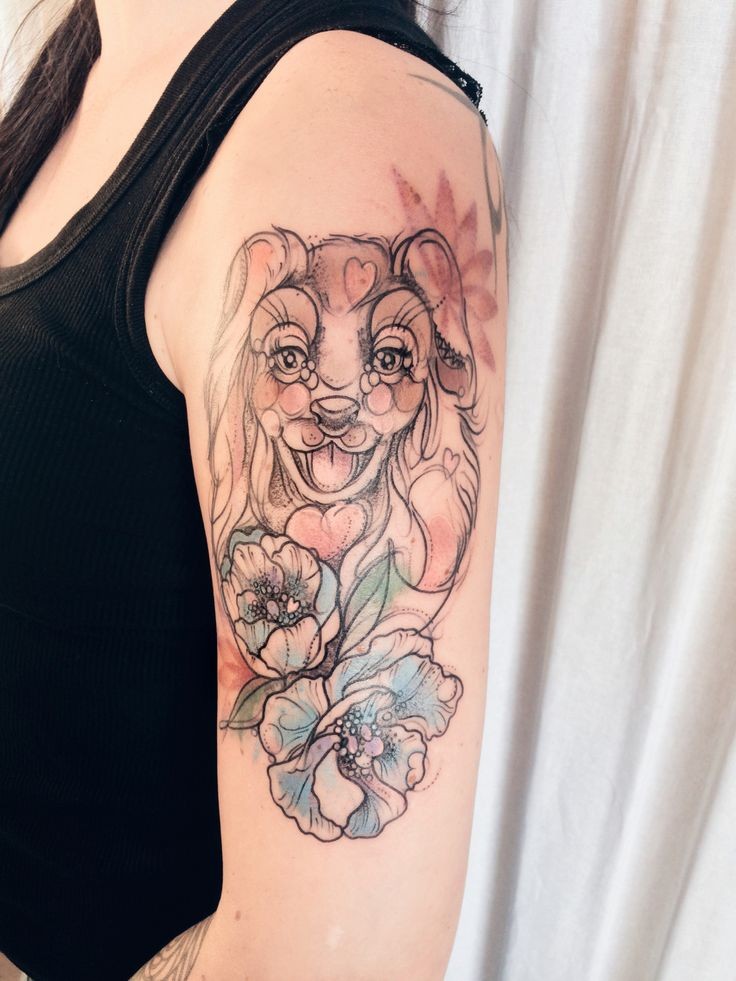 Sketch style colored shoulder tattoo of cute dog with flowers