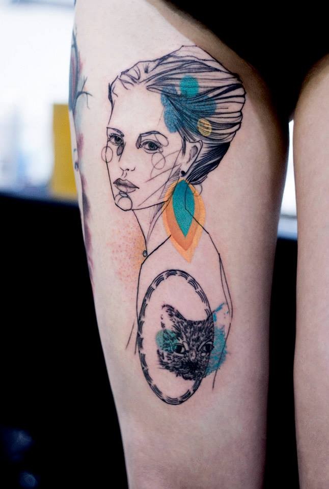 Sketch style colored thigh tattoo of woman portrait