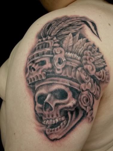 Skull in headdress priest aztec tattoo on shoulder