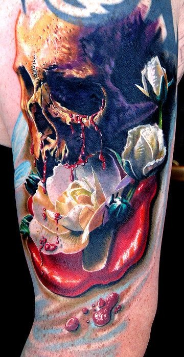Tatuaggio incantevole sul braccio il teschio colorato con le rose
