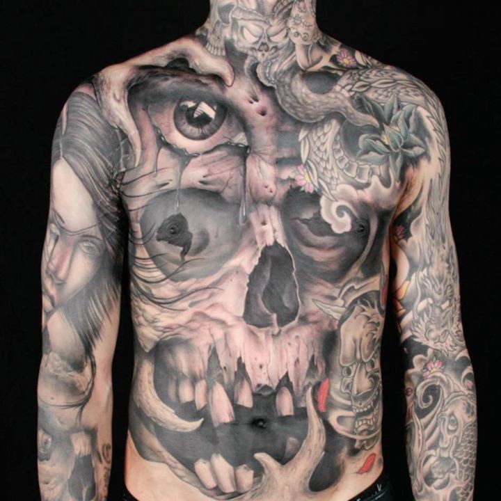 Full body skull themed tattoo