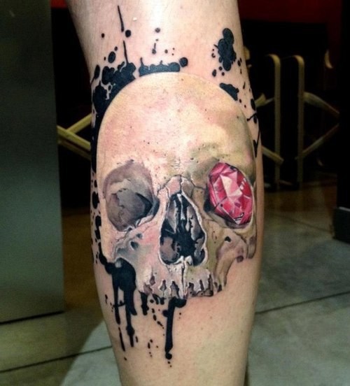 Skull with a pink diamond in orbit tattoo