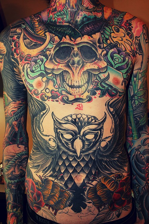 Skull with big black owl tattoo on whole body