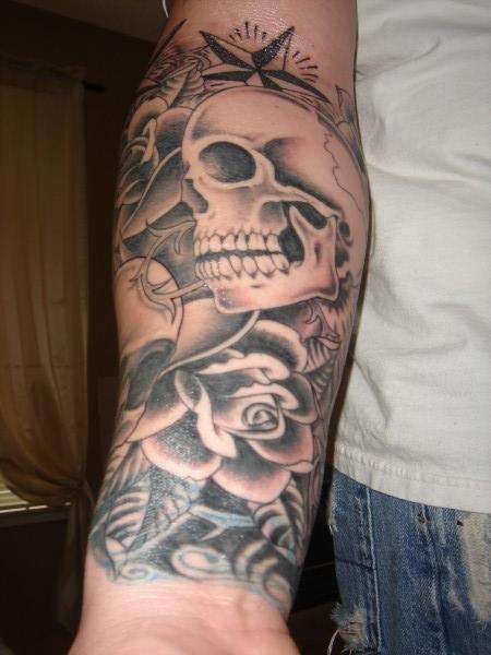 Skull with roses forearm tattoo photo