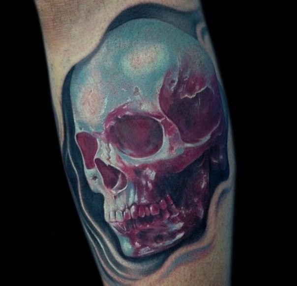 Small 3D style colored leg tattoo of human skull