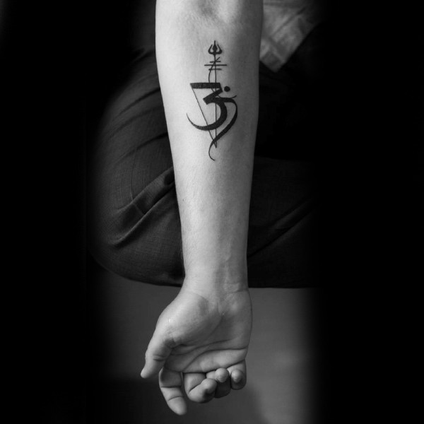 Small Asian black ink forearm tattoo of mystical symbol