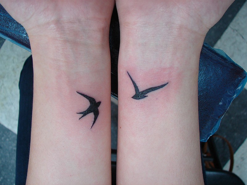 Small birds tattoo on both hands