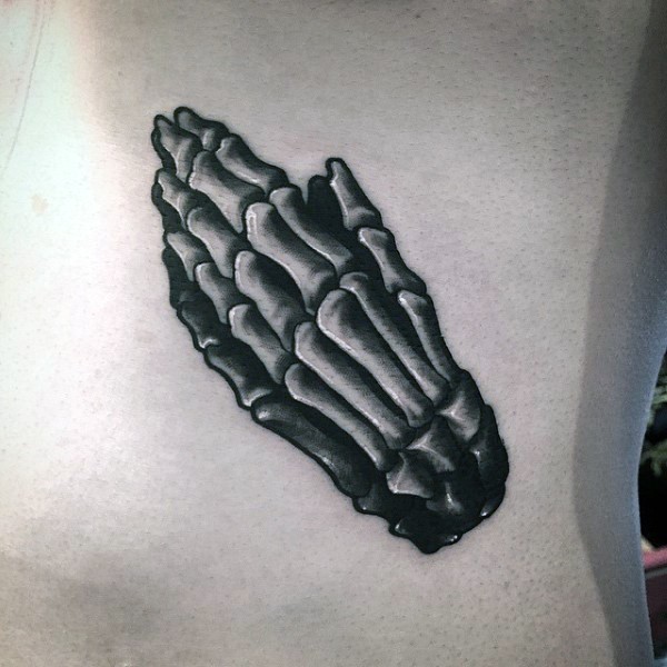 Small black ink back tattoo of praying human hands