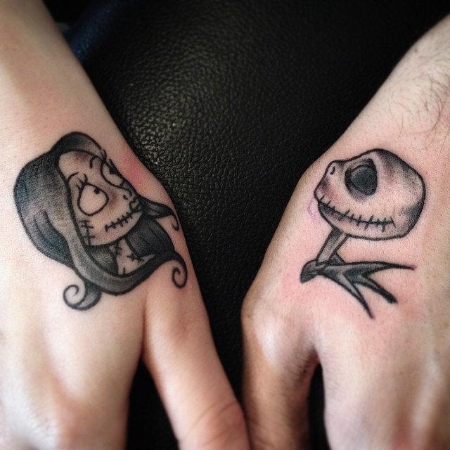 Small black ink hands tattoo of Nightmare before Christmas couple portraits