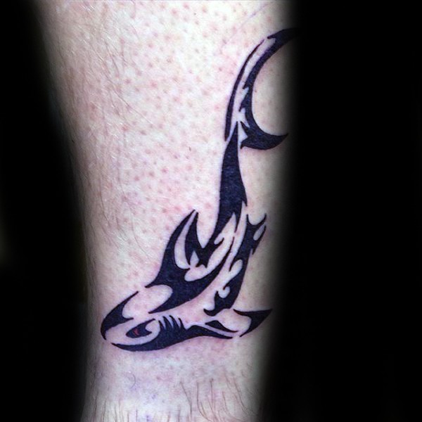 Small black ink Polynesian style tattoo of shark