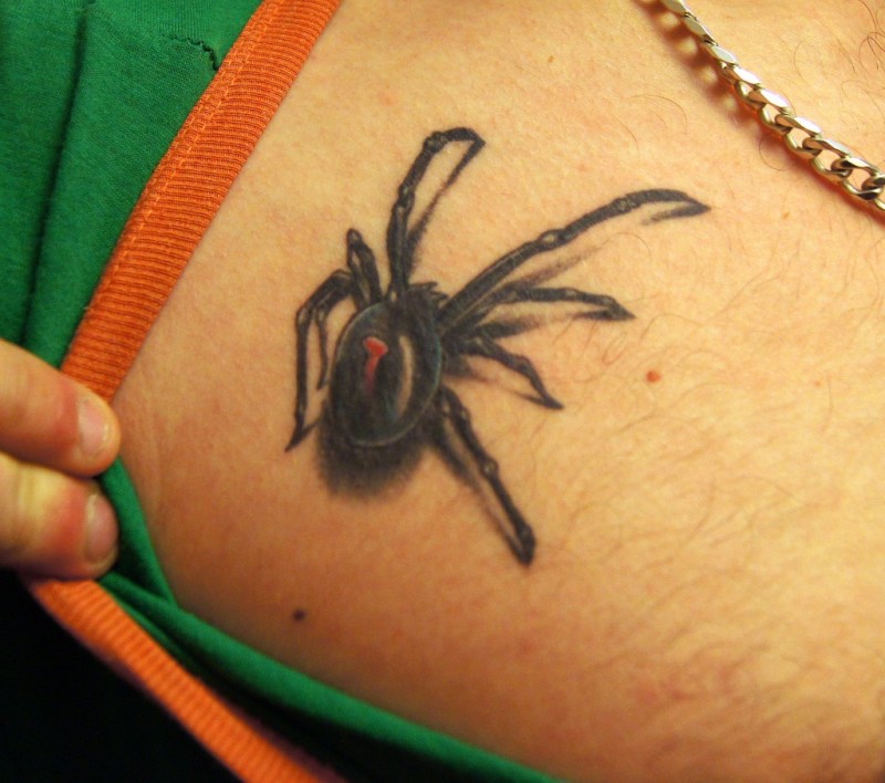 Small black spider tattoo